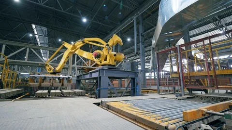 Automated machine moves bricks on a working conveyor. Stock Footage 116342076