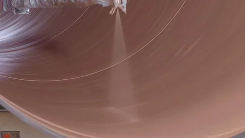 Automated machine is painting the rotating pipe from inside Video stock 76832653