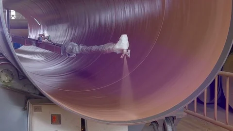 Automated machine is painting the rotating pipe from inside Video stock 76833583
