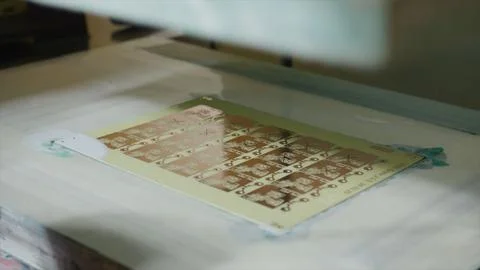 Automated machine printing electronic components on circuit board in factory Stock Photos