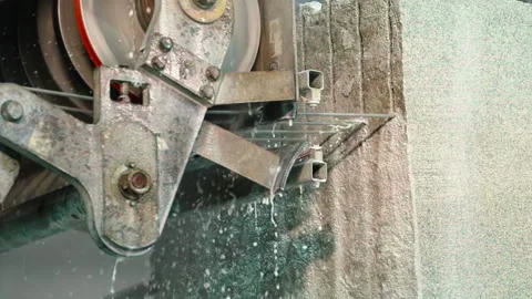 Automated machinery is processing the granite stone at a modern production plant Stock Footage 220472032