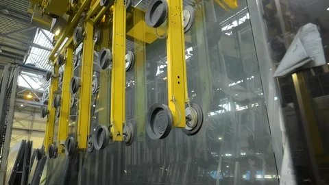 Automated manipulator with suction cups transporting glass panel at factory Stock Footage 90409840