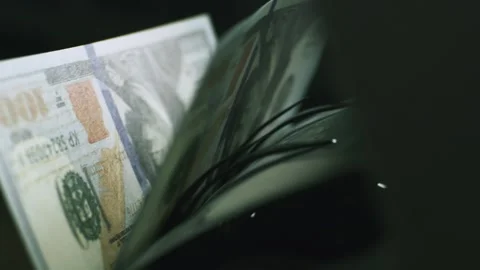 Automated money counting machine processing stack of hundred dollar bills f.. Stock Footage 337448184