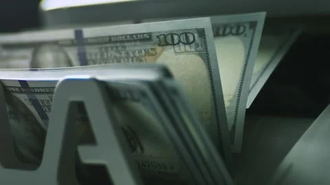 Automated money counting machine processing stack of hundred dollar bills i.. Stock Footage 337537590