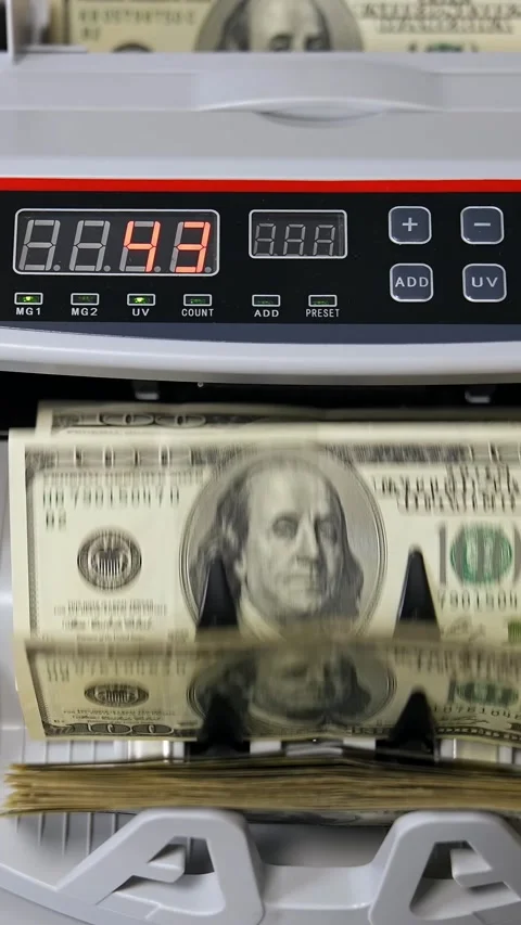 Automated money counting machine processing stack of hundred dollar bills i.. Stock Footage 337542672