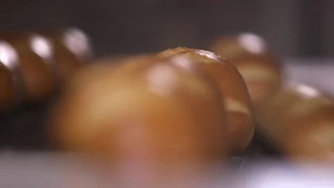 Automated output of finished bread from the oven. Video stock 139702343