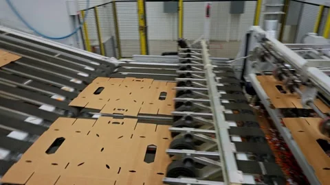 Automated Packaging Machinery Processing Cardboard Sheets on Factory Line Stock Footage 337438145