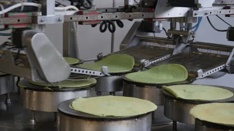 Automated pancake making process at a ready-made food factory Stock Footage 165284351