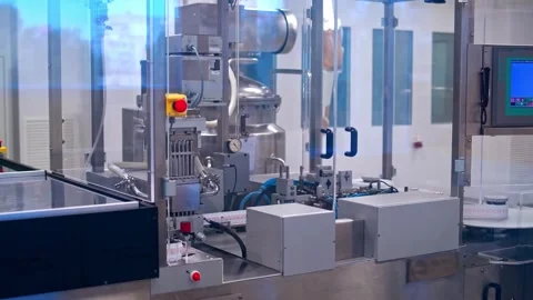 Automated pharmaceutical production line operating in clean sterile laborat.. Stock Footage 337482403