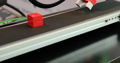 Automated programmable machine takes the cube from the conveyor belt. Industr Stock Footage 112075783