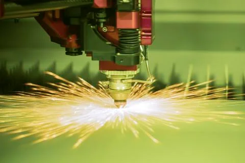 Automated programmed machine. Industrial laser machine cuts out parts in shee Stock-Fotos