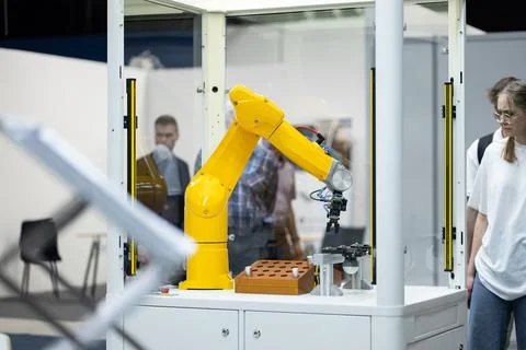 Automated programmed robotic arm for manufacturing and industrial lines conveyor Stock Photos