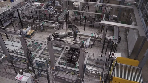 Automated robot lifting and moving items in industrial brewery, drone aerial 4K Stock Footage 101141172