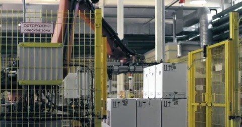 An automated robotic arm is loading and assembling products Stock Footage 78015880