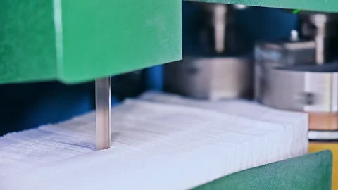 Automated rolling sheets of cellulose for making diapers.  Video stock 166022890