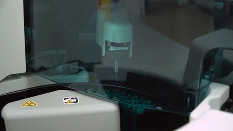 Automated sample taking machine operation. Close-up view. Stock Footage 119768153