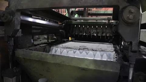 Automated sand molding machine with squeegee leveling and pressing sand mold on Video stock 336564196