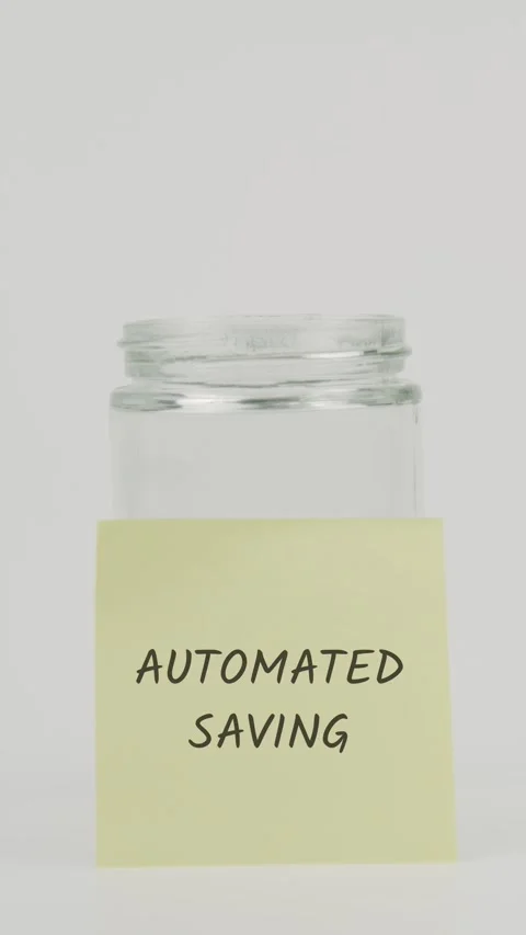 Automated saving text or word on yellow sticky note attached to glass jar Stock Footage 311679270