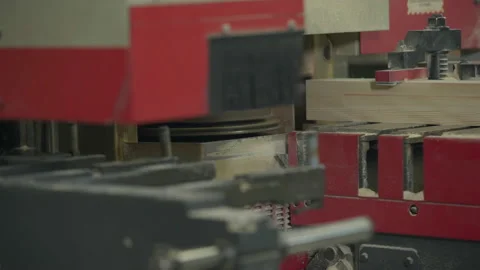 Automated saw machine processing the multiple wooden planks at the carpentry Stock Footage 201664437