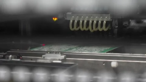 Automated SMT solder paste printing machine applying paste onto green PCB board Stock Footage 334689288