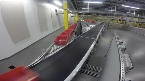Automated Sorting System Utilizing Red Baskets on a Conveyor Belt for Efficient Stock Footage 312172454