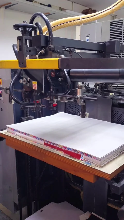 Automated Suction Feed Mechanism Picking Up Paper in Offset Printing Press Stock Footage 337474768