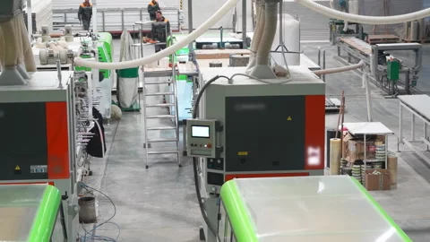 Automated system mixes hot microplastic in modern industrial workshop Stock Footage 304392887