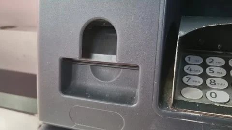 An automated teller machine (ATM) issues a receipt. Stock Footage 247169397