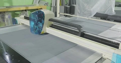 Automated Textile Cutting on CNC Plotter Machine. CNC Fabric Cutting Process in Stock Footage 336563524