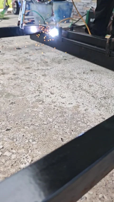Automated welding machine smoothly joins metal profiles, creating sparks and a Stock Footage 315355930