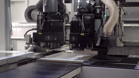 An automated woodworking machine moves a panel Stock Footage 336073122