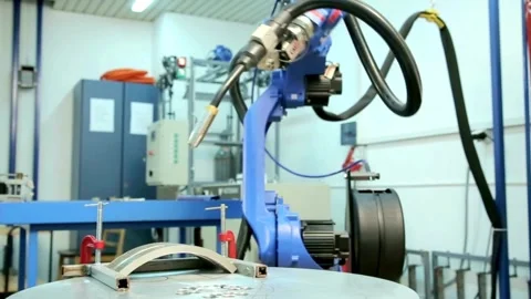 Automated work with robotic hands in the modern industrial iron and aluminum Stock Footage 334587256