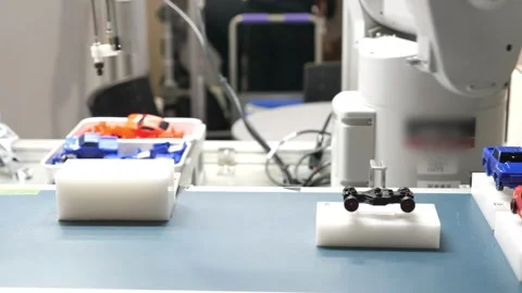 Automated work with robotic hands in the modern industrial iron and aluminum Stock Footage 334587264