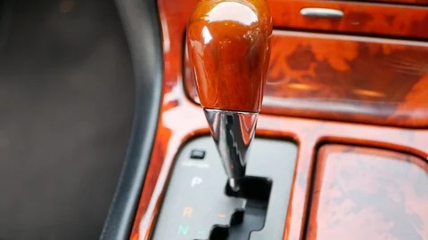 Automatic 5 speed gearbox selector in a luxury car Stock Footage 122496422