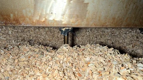 Automatic Agitator Stirring Beech Wood Chips in Industrial Smoke Generator Stock Footage 330595397