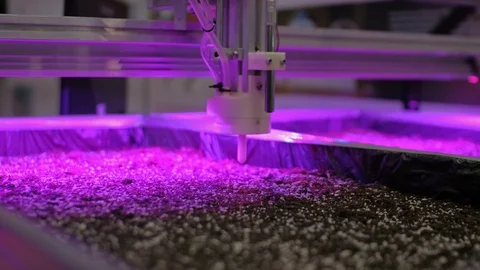 Automatic agricultural robotic device making soil dimples for sowing. 库存影片 94775986