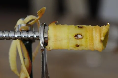 Automatic apple slicer which peels the apple and cuts it into slices Stock Photos
