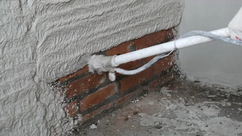 Automatic Application of Plastering Mixture to Brick Wall. Repair in House Stock Footage 168354673