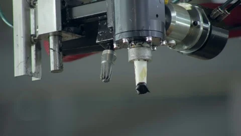 Automatic application of a sealant on a rear window of a car during producing on Stockbeeldmateriaal 83430237