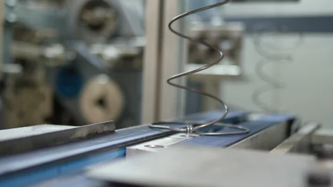 Automatic arc-making machine. They head over to a conveyor belt on their way Stock Footage 129935806