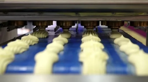 Automatic bakery line, close up of producing cakes in bakery industry Stock Footage 52179416