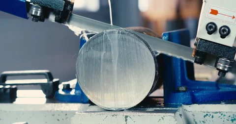 Automatic band saw with coolant cuts metal rods of workpieces, industrial band Stock Footage 167787658