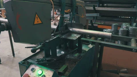 Automatic Band Saw Cutting Metal Pipe: Industrial Machine with Control Panel Stock Footage 343904089