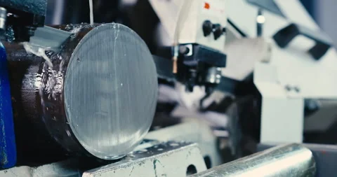 The automatic band saw machine cutting the metal rod. The machine tool operation Stock Footage 264114519