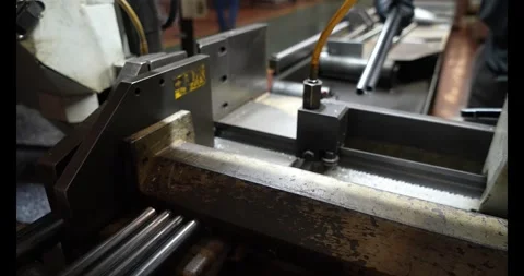 Automatic band saw machine with water coolant cutting metal pipes. 스톡 동영상 333980522