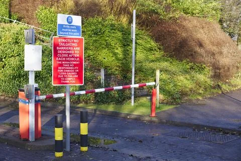 Automatic barrier access control beware bollards and sign Stock Photos