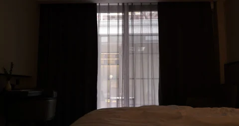 Automatic blackout curtains closing in a hotel room Stock Footage 322043855
