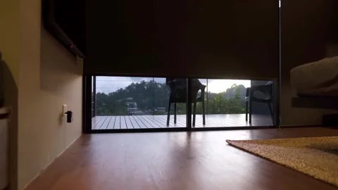 Automatic blackout roller blinds opening to a scenic terrace view Stock Footage 340002763