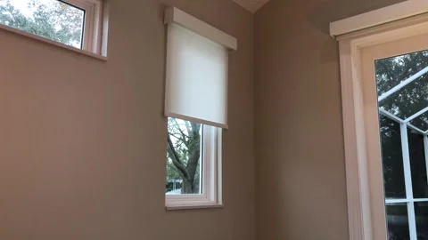 Automatic blind closes and opens over a small window Video stock 260219722