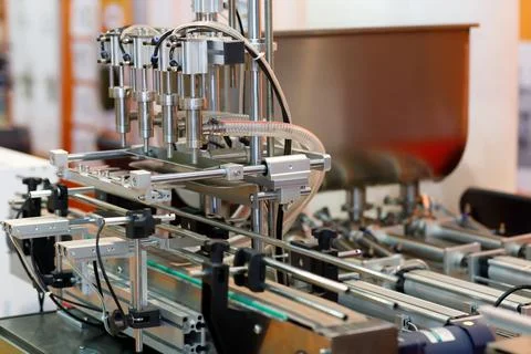 Automatic bottle filling machine Stock Photos